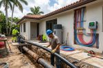 Modern PEX pipe replacement installation inside a Miami residential home during renovation