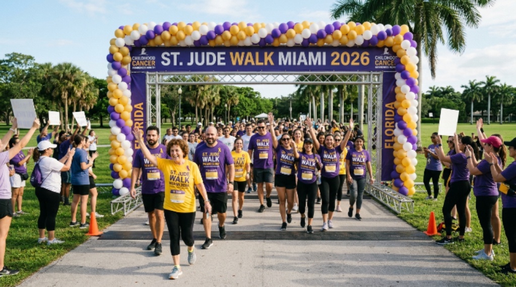 A group of walkers crossing the starting line at the St. Jude Walk Miami 2026 during Childhood Cancer Awareness Month in Florida